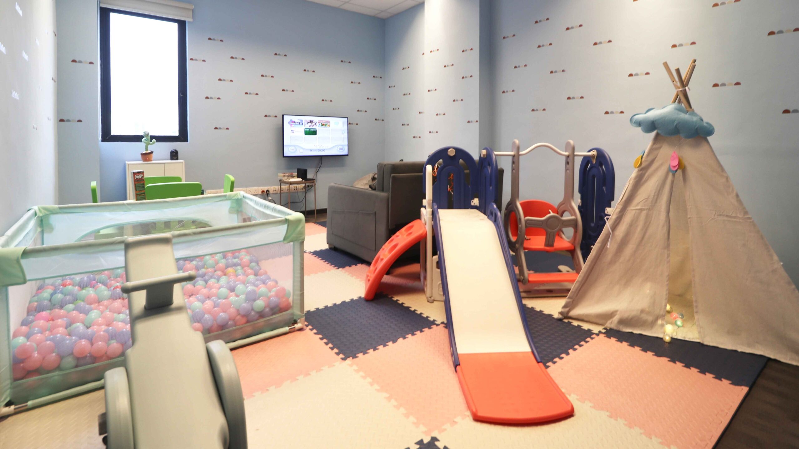 Kids club at LK Residences with slide, ball pit, Nintendo Wii and more.